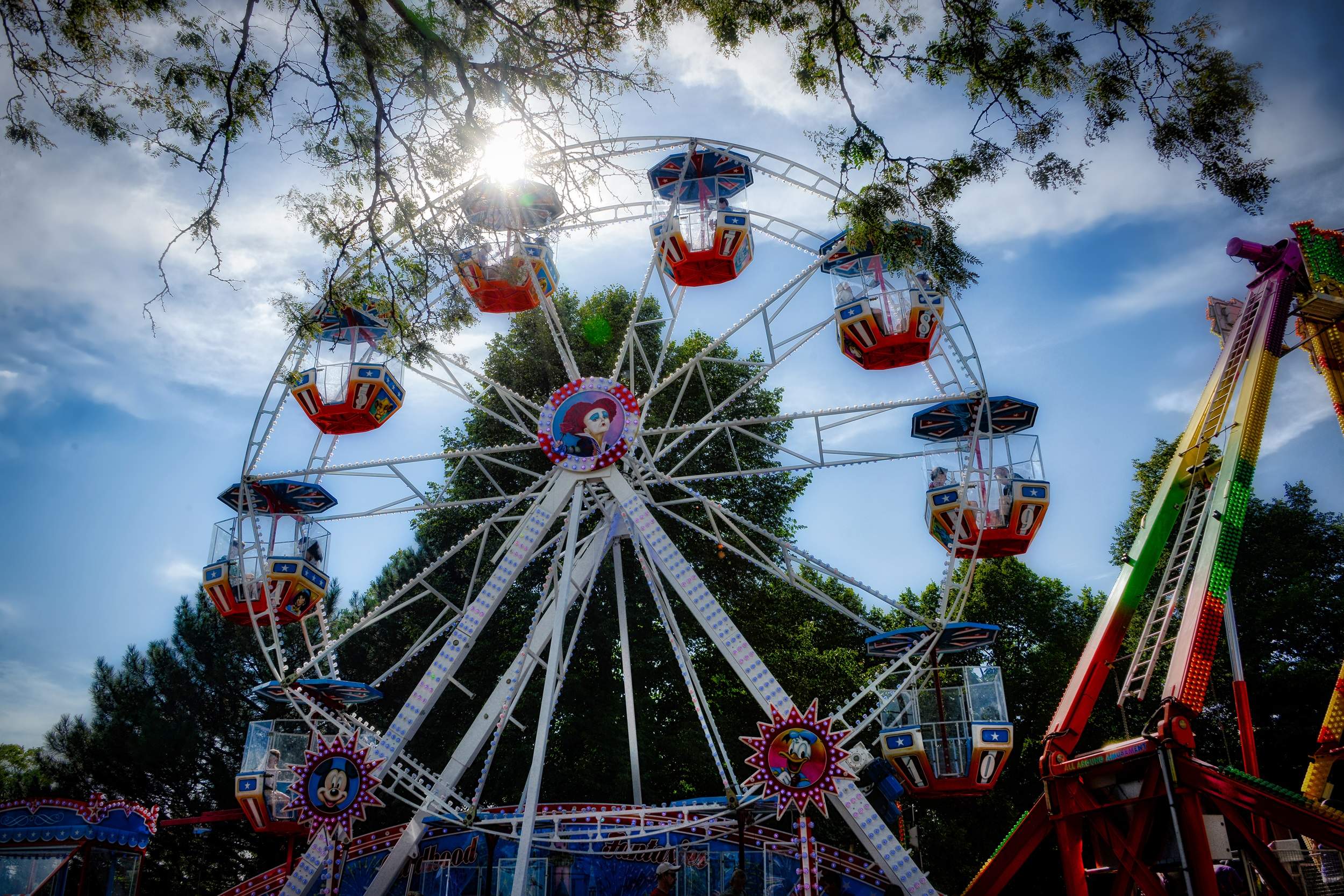 A ferris wheel against a blue sky at the Naperville Spring Fling