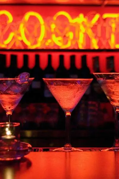 Martini glasses on the counter at a swanky speakeasy