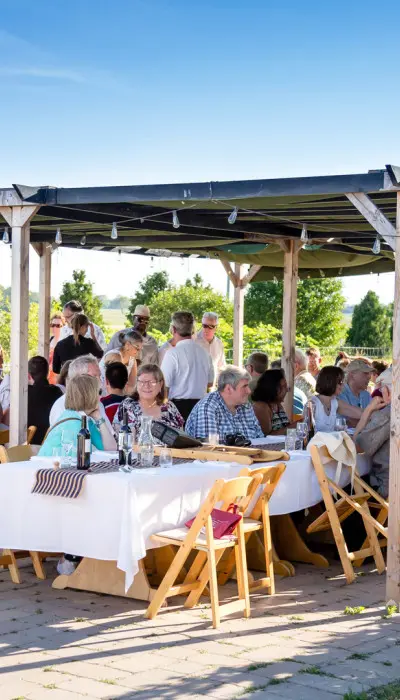 People gathered around tables and socialising.