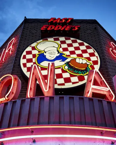 A neon sign for Fast Eddie's Bon Air in Alton