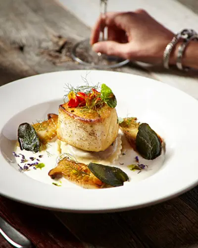 A plate of food on a wooden table