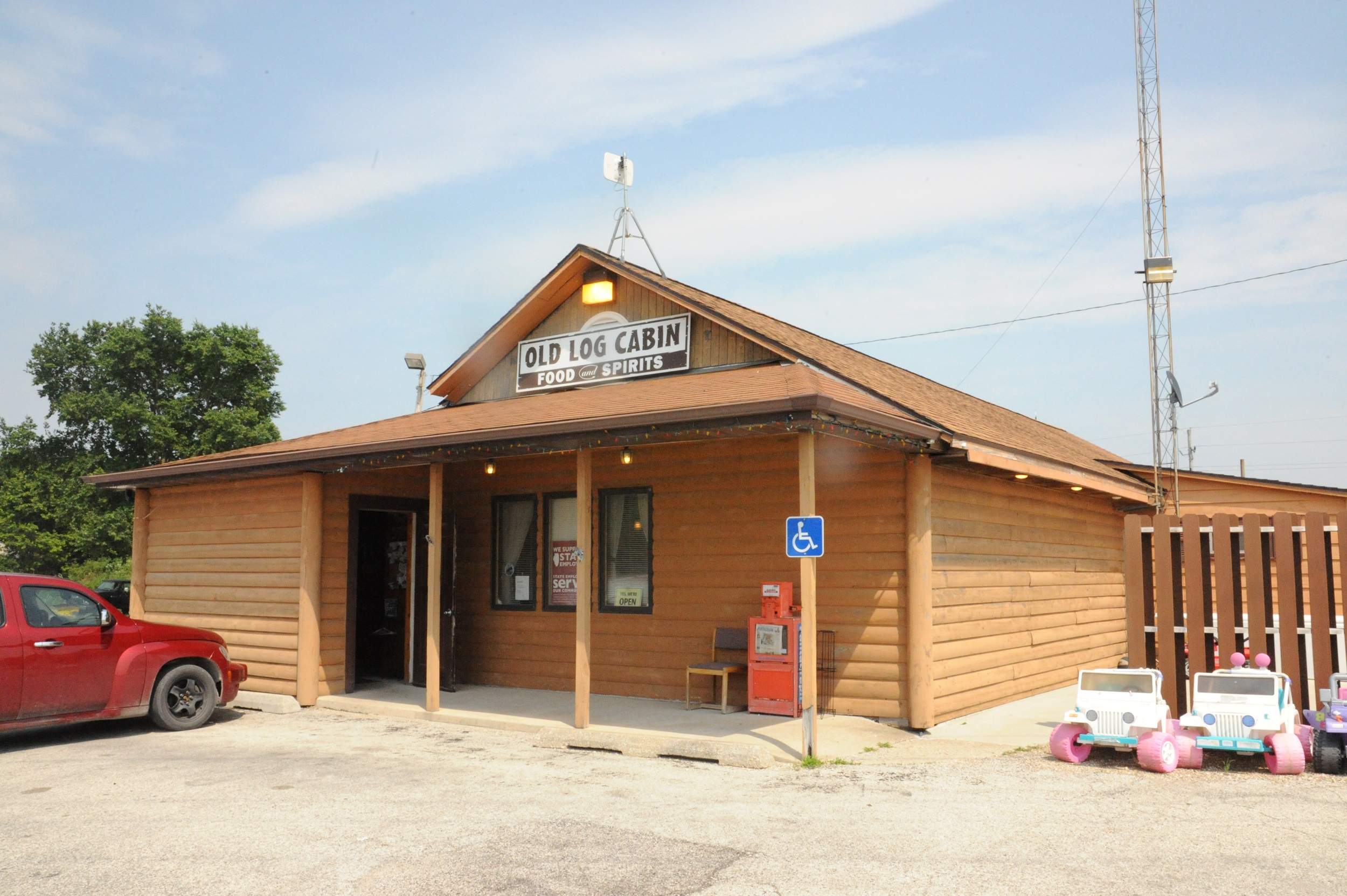 The front of the quaint Old Log Cabin Inn in Pontiac