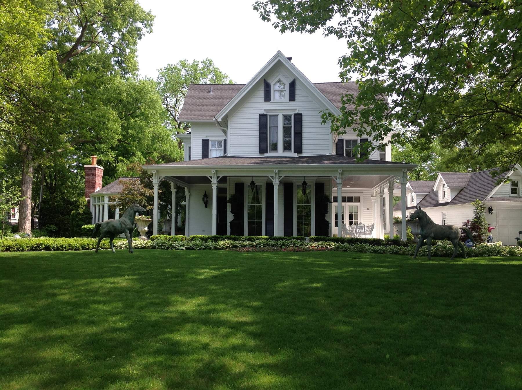 A two-storey, 19th century home with a green lawn in front