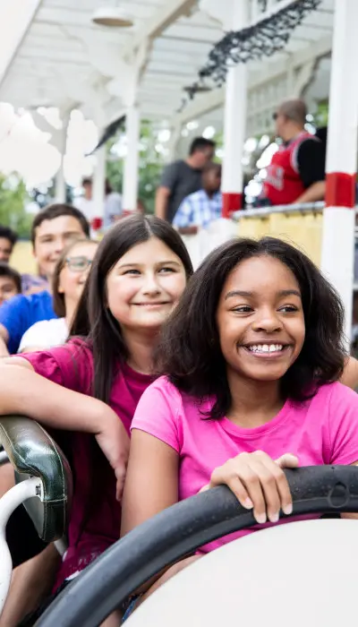 Kids on a amusement park ride at Six Flags.