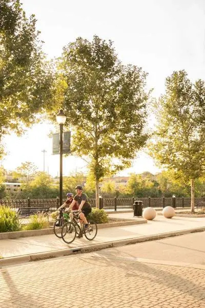 Bikers on a path during summer in Elgin.