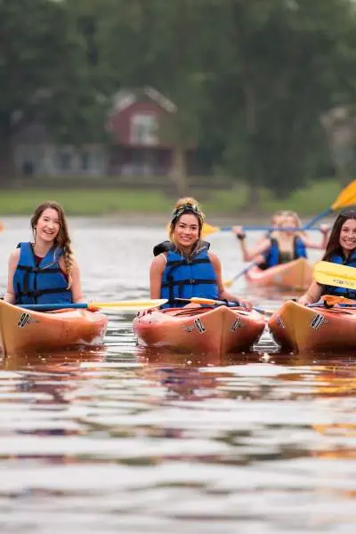 Group of friends canoeing.