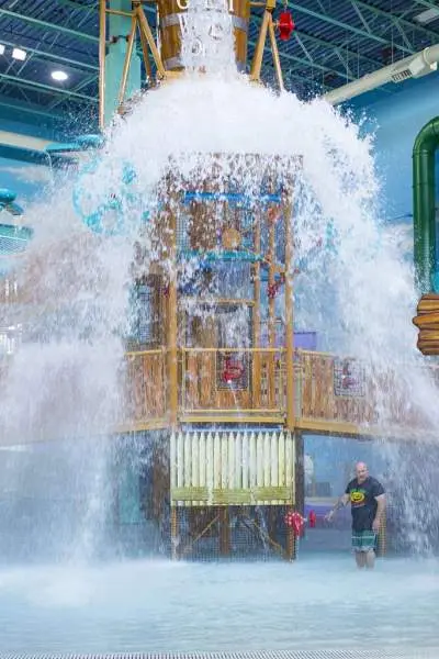 Water being dumped over playground at a water park