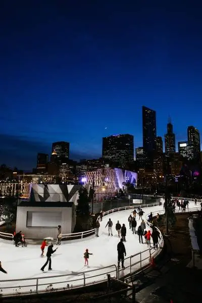 People ice skating on a track 